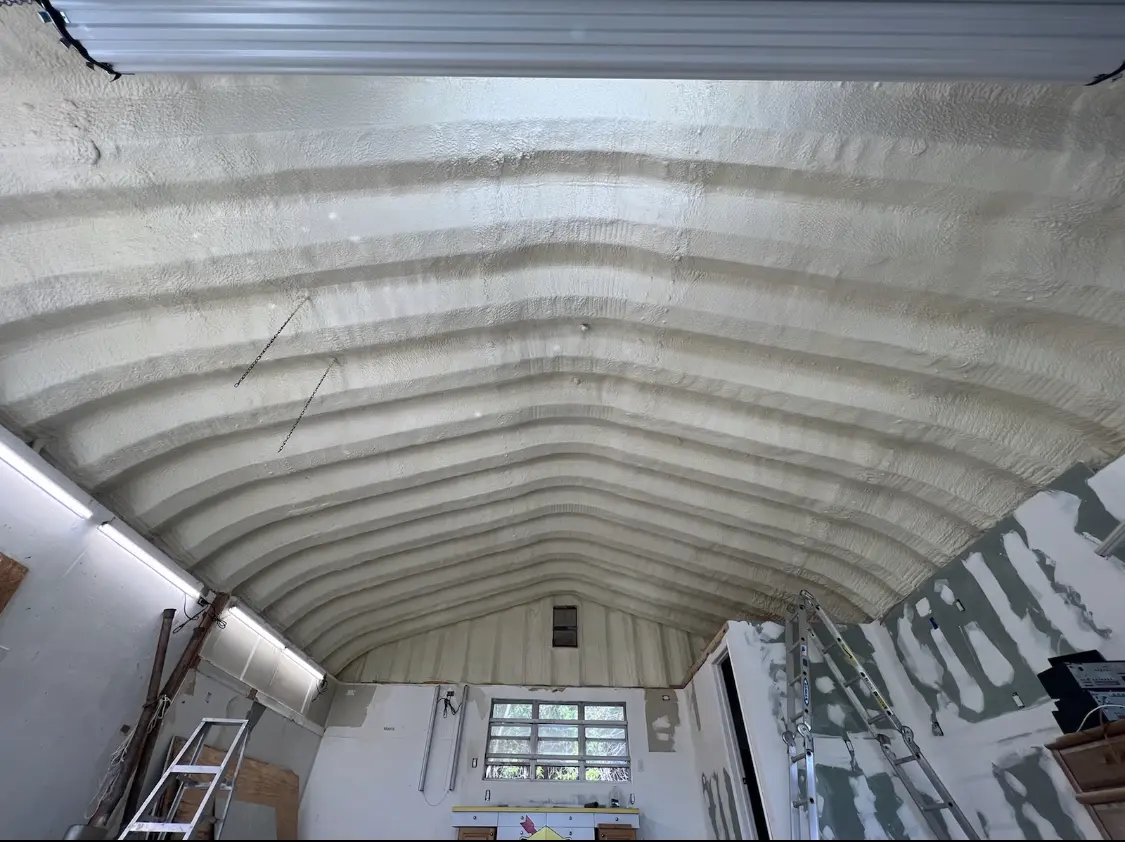 Spray polyurethane foam applied to the underside of a metal roof deck in Streator